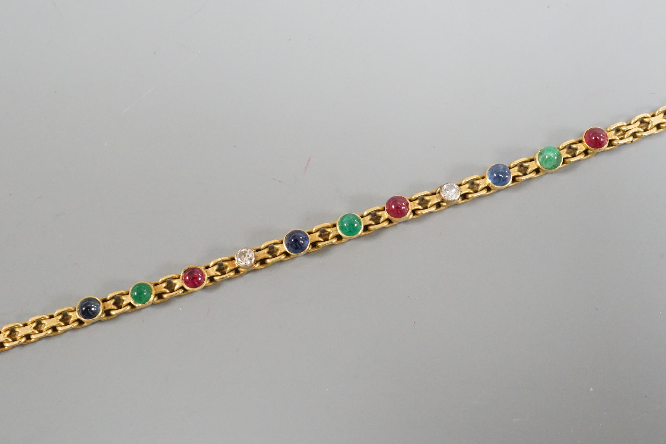 A modern yellow metal, diamond and cabochon gem set bracelet, 17.5cm, gross weight 9.6 grams.